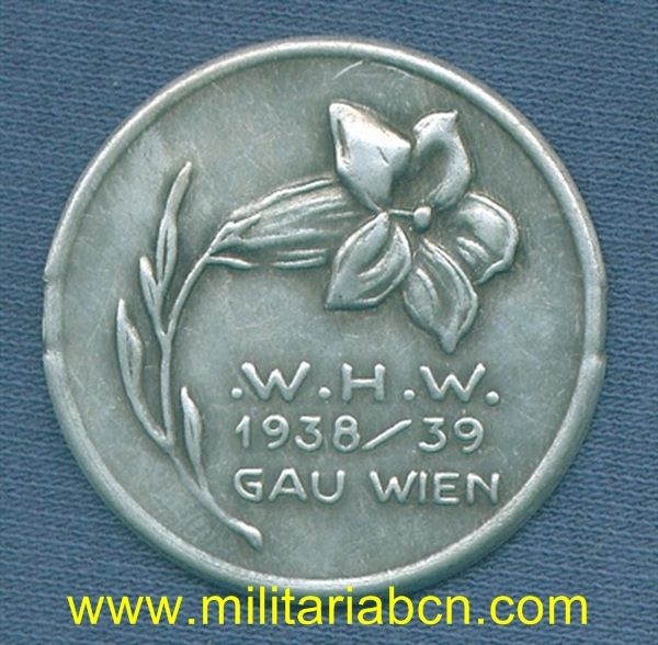 Alemania III Reich. Insignia del Winterhilfe Werk. 1938-39. Wien. Sin aguja posterior.